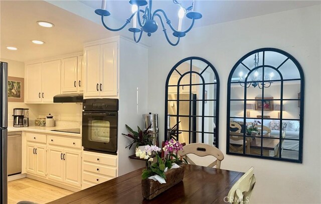 2148 Ronda Granada Unit A, Laguna Woods, CA 92637 - dining area with a chandelier, recessed lighting, and light wood-style floors