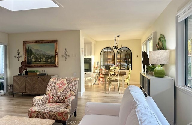 2148 Ronda Granada Unit A, Laguna Woods, CA 92637 - living area with light wood finished floors and a skylight