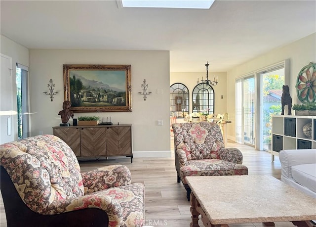 2148 Ronda Granada Unit A, Laguna Woods, CA 92637 - living area with light wood-type flooring and healthy amount of natural light