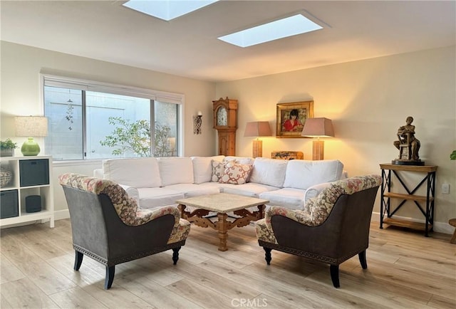 2148 Ronda Granada Unit A, Laguna Woods, CA 92637 - living area featuring a skylight and light wood-type flooring
