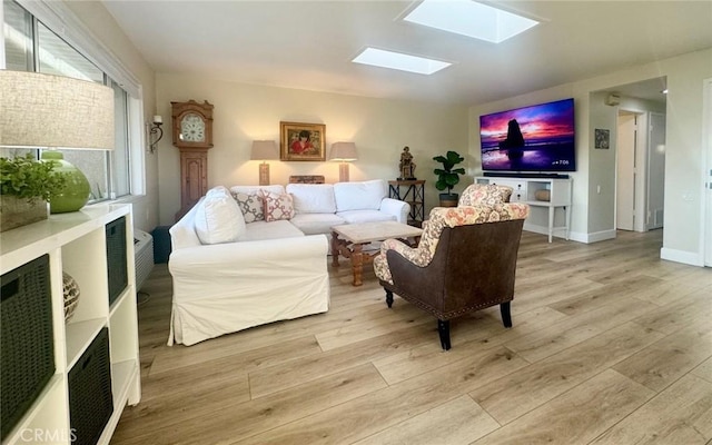 2148 Ronda Granada Unit A, Laguna Woods, CA 92637 - living area with a skylight and light wood-style floors