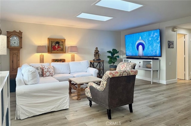 2148 Ronda Granada Unit A, Laguna Woods, CA 92637 - living room featuring light wood-type flooring and a skylight