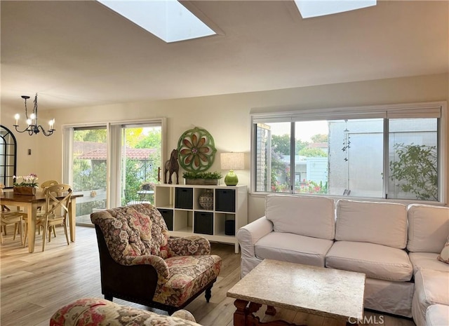 2148 Ronda Granada Unit A, Laguna Woods, CA 92637 - living area featuring a skylight, a chandelier, and healthy amount of natural light
