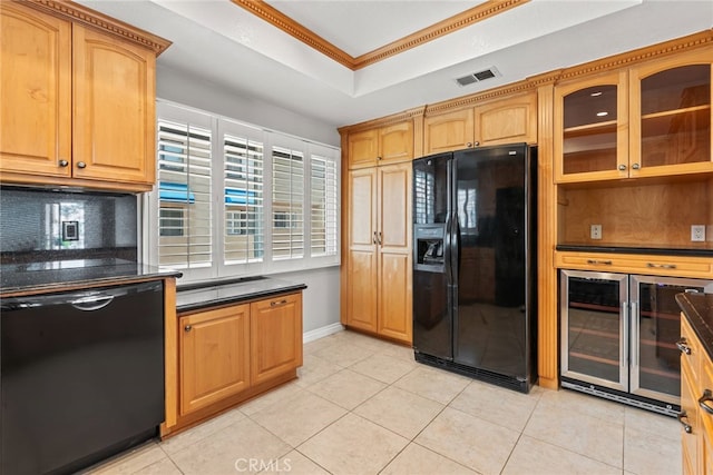 3211 Anne Cir Unit Ci102, Huntington Beach, CA 92649 - kitchen with black appliances, beverage cooler, a tray ceiling, dark countertops, and ornamental molding