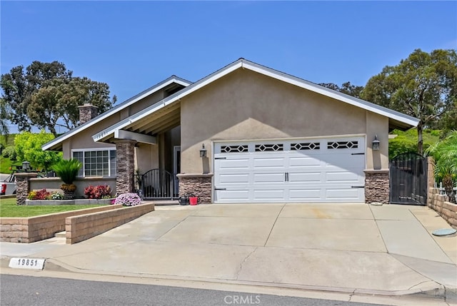 19851 Ridgewood Pl, Yorba Linda, CA 92886 - view of front facade with stone siding, a gate, and stucco siding