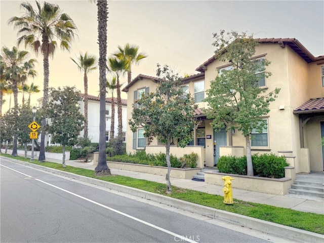 867 E Prommenade Unit B, Azusa, CA 91702 - view of front of property featuring a tiled roof and stucco siding