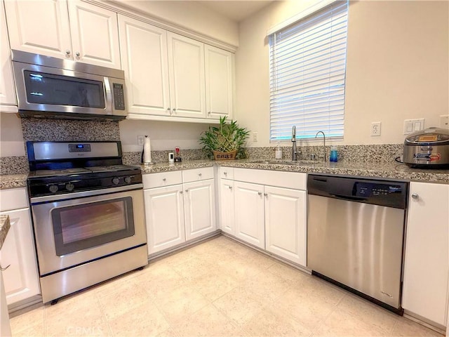 867 E Prommenade Unit B, Azusa, CA 91702 - kitchen with appliances with stainless steel finishes and white cabinetry