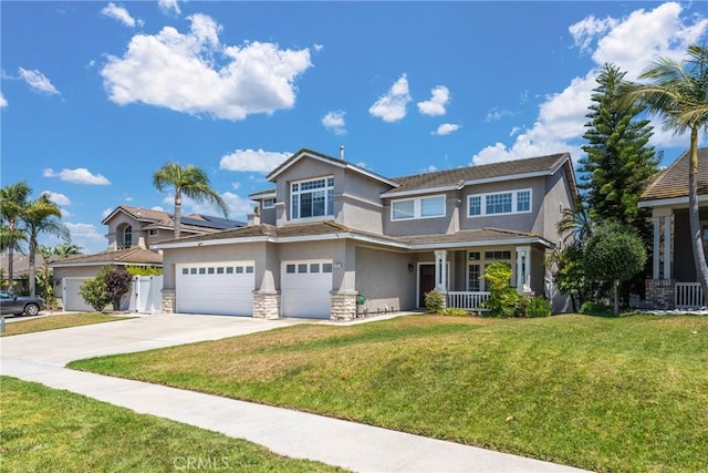982 Big Spring Ct, Corona, CA 92878 - view of front of house with stucco siding, driveway, covered porch, a front lawn, and stone siding