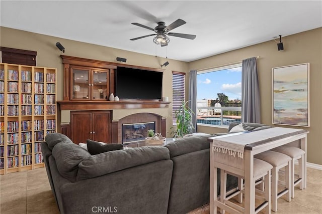 982 Big Spring Ct, Corona, CA 92878 - living area featuring a ceiling fan, light tile patterned floors, and a tiled fireplace