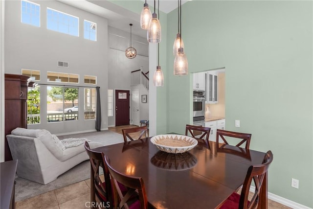 982 Big Spring Ct, Corona, CA 92878 - dining space with a towering ceiling and light tile patterned flooring