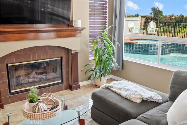 982 Big Spring Ct, Corona, CA 92878 - tiled living room featuring a tiled fireplace and baseboards