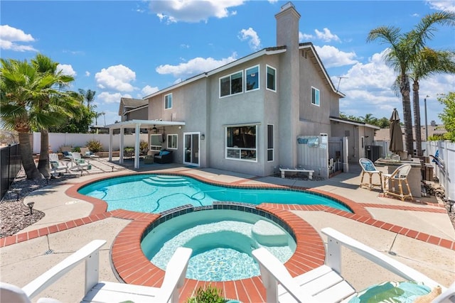 982 Big Spring Ct, Corona, CA 92878 - view of pool featuring a pool with connected hot tub, a fenced backyard, a patio, and ceiling fan