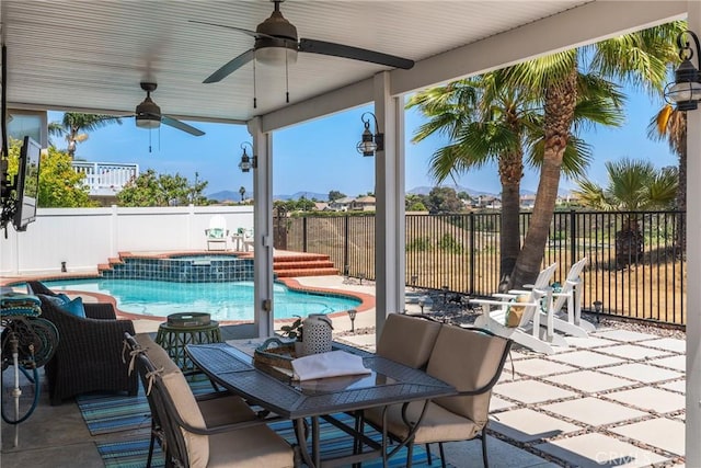 982 Big Spring Ct, Corona, CA 92878 - fenced backyard with a ceiling fan, a pool with connected hot tub, a patio area, and outdoor dining space