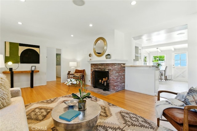 5517 Bevis Ave, Sherman Oaks, CA 91411 - living area featuring wood finished floors, a fireplace, and recessed lighting