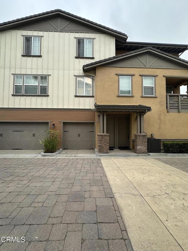 1430 Windshore Way, Oxnard, CA 93035 - view of front of house with an attached garage, board and batten siding, and driveway