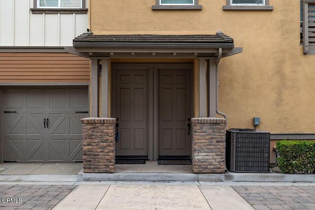 1430 Windshore Way, Oxnard, CA 93035 - doorway to property with a garage and stucco siding