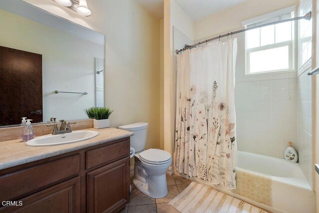 1430 Windshore Way, Oxnard, CA 93035 - full bathroom featuring vanity, shower / bath combo with shower curtain, and tile patterned floors