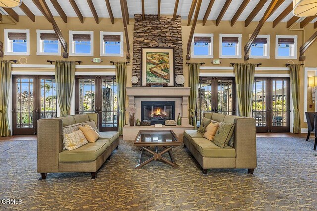 1430 Windshore Way, Oxnard, CA 93035 - carpeted living area with french doors, a towering ceiling, beamed ceiling, and a fireplace