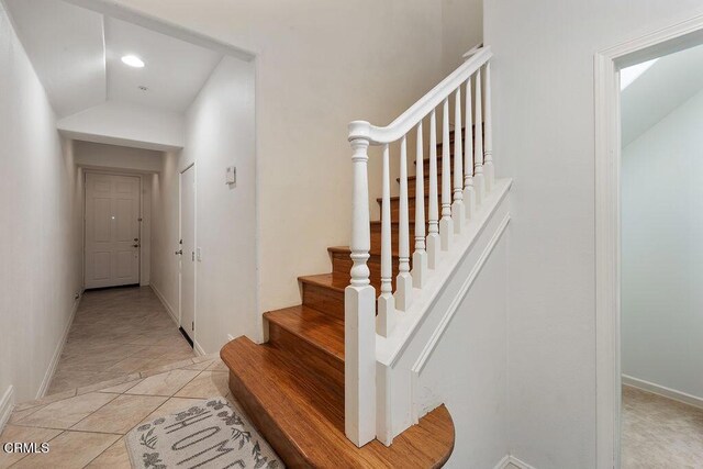 1430 Windshore Way, Oxnard, CA 93035 - stairway featuring baseboards and vaulted ceiling