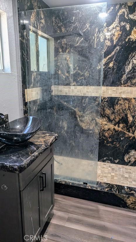 929 Trinity Dr, Lake Arrowhead, CA 92352 - bathroom featuring vanity, a walk in shower, and wood finished floors