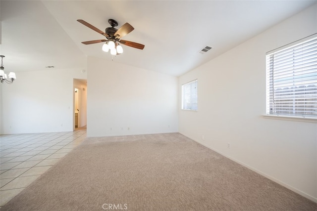 158 Colt Ln, Nipomo, CA 93444 - empty room with vaulted ceiling, a chandelier, a ceiling fan, and light tile patterned floors