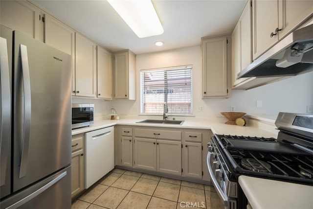 158 Colt Ln, Nipomo, CA 93444 - kitchen with stainless steel appliances, light tile patterned floors, under cabinet range hood, light countertops, and recessed lighting