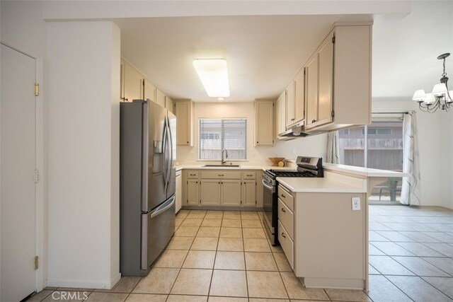 158 Colt Ln, Nipomo, CA 93444 - kitchen with stainless steel appliances, light countertops, a chandelier, a peninsula, and light tile patterned flooring
