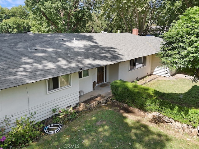 1915 Manzanita Ave, Chico, CA 95926 - view of front facade with roof with shingles, a front lawn, and a chimney