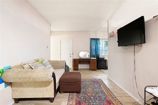 1915 Manzanita Ave, Chico, CA 95926 - living area with light wood-style floors and baseboards