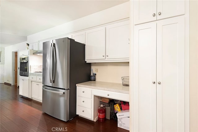 1915 Manzanita Ave, Chico, CA 95926 - kitchen featuring appliances with stainless steel finishes, dark wood-style flooring, light countertops, and white cabinets