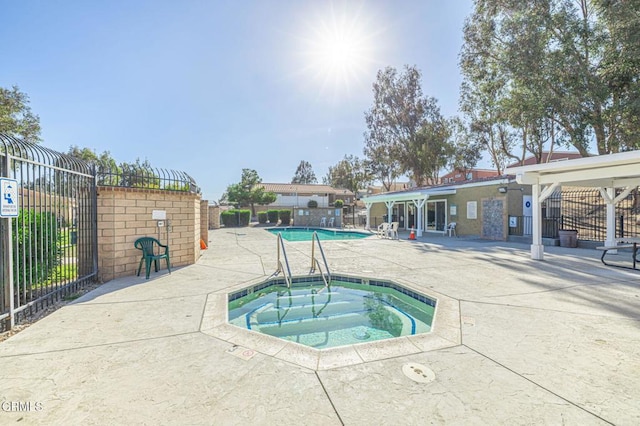 2400 Sunset Ridge Dr, Rosamond, CA 93560 - community pool featuring a community hot tub and a patio area