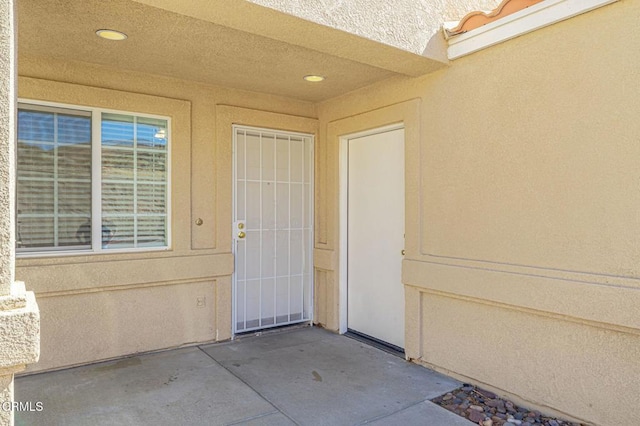 2400 Sunset Ridge Dr, Rosamond, CA 93560 - property entrance with a patio and stucco siding