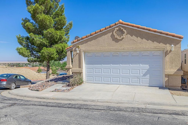 2400 Sunset Ridge Dr, Rosamond, CA 93560 - view of front of property with driveway, stucco siding, an attached garage, and a tiled roof