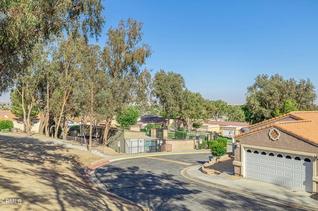 2400 Sunset Ridge Dr, Rosamond, CA 93560 - view of front facade with stucco siding, a residential view, and driveway