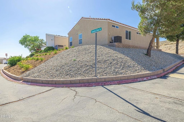 2400 Sunset Ridge Dr, Rosamond, CA 93560 - view of property exterior with stucco siding