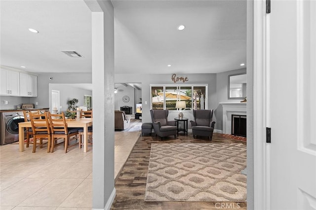 16128 Haldane St, Whittier, CA 90603 - living room with washer / clothes dryer, a fireplace, and recessed lighting