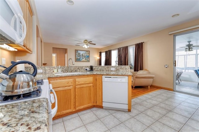 13524 Via Santa Catalina, Sylmar, CA 91342 - kitchen with white appliances, a ceiling fan, light tile patterned floors, and a peninsula