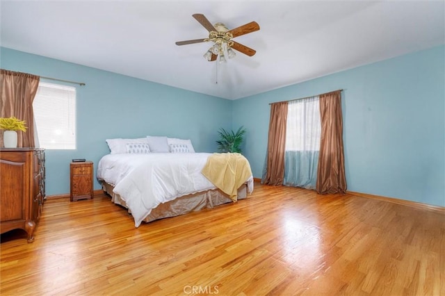 13524 Via Santa Catalina, Sylmar, CA 91342 - bedroom with multiple windows, light wood-style floors, and ceiling fan