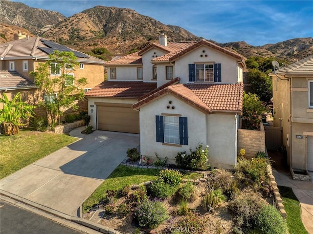 13524 Via Santa Catalina, Sylmar, CA 91342 - mediterranean / spanish-style home with stucco siding, a tile roof, an attached garage, and driveway