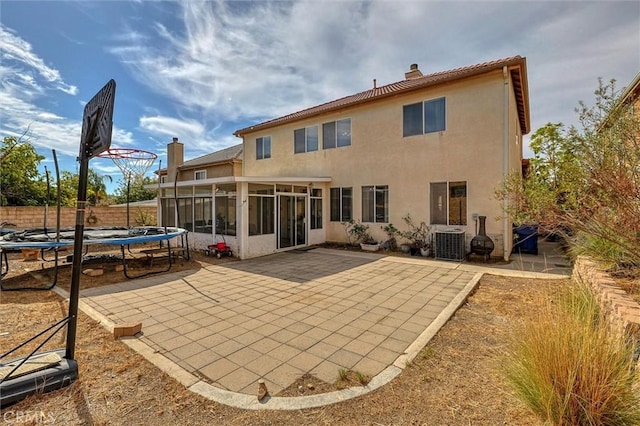 13524 Via Santa Catalina, Sylmar, CA 91342 - rear view of property with a trampoline, a sunroom, a chimney, and a patio
