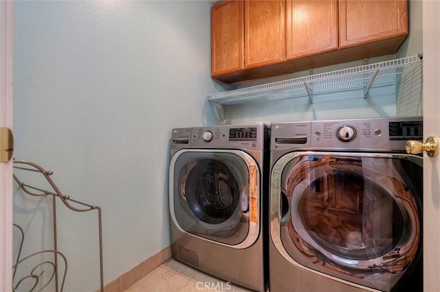 13524 Via Santa Catalina, Sylmar, CA 91342 - laundry area with cabinet space, washer and clothes dryer, and light tile patterned floors