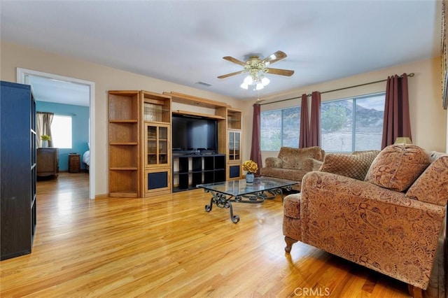 13524 Via Santa Catalina, Sylmar, CA 91342 - living area with light wood-style floors and a ceiling fan