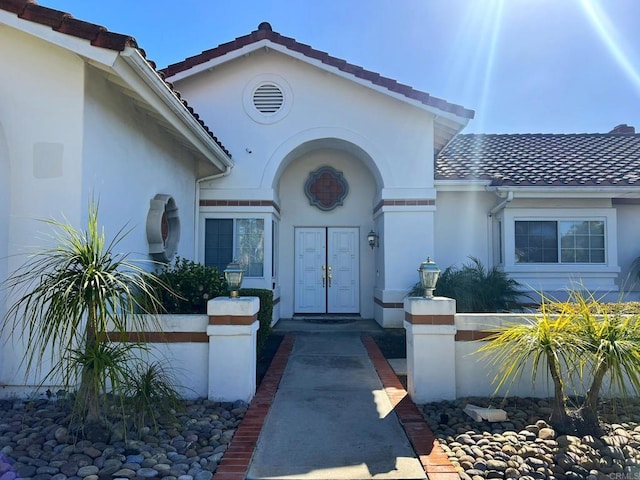 14109 Arbolitos Dr, Poway, CA 92064 - doorway to property featuring stucco siding and a tiled roof