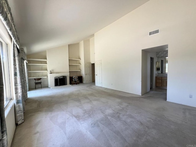 14109 Arbolitos Dr, Poway, CA 92064 - unfurnished living room featuring high vaulted ceiling, a fireplace, and carpet flooring
