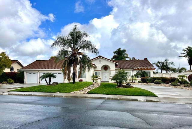 14109 Arbolitos Dr, Poway, CA 92064 - mediterranean / spanish-style house with a tile roof, driveway, a front lawn, and an attached garage