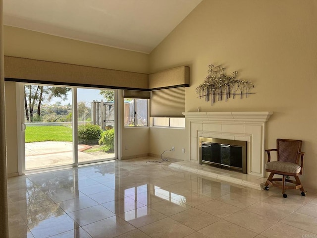 14109 Arbolitos Dr, Poway, CA 92064 - unfurnished living room featuring light tile patterned flooring, high vaulted ceiling, and a tile fireplace