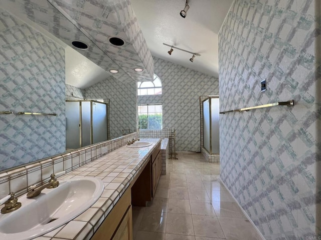 14109 Arbolitos Dr, Poway, CA 92064 - bathroom with a stall shower, double vanity, tile patterned flooring, and rail lighting