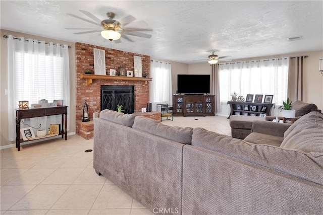 14616 Lighthouse Ln, Helendale, CA 92342 - living area with ceiling fan, light tile patterned floors, a brick fireplace, and a textured ceiling