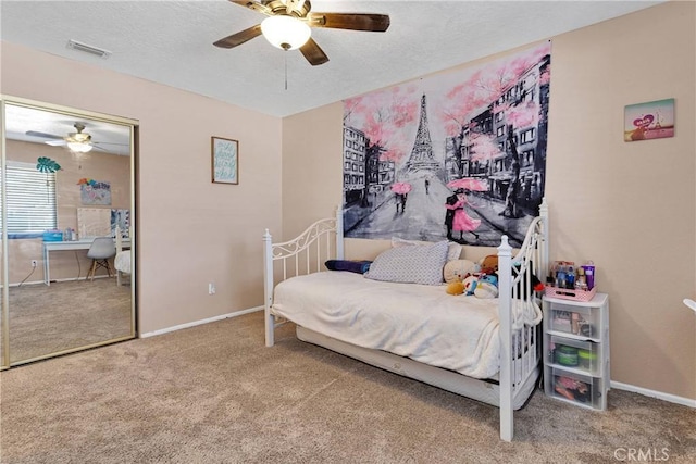 14616 Lighthouse Ln, Helendale, CA 92342 - bedroom with carpet, a textured ceiling, ceiling fan, a desk, and a closet