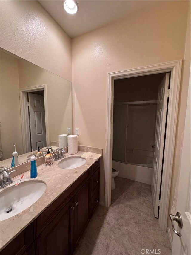 2944 E Via Terrano, Ontario, CA 91764 - full bath with double vanity, tile patterned floors, and bathtub / shower combination